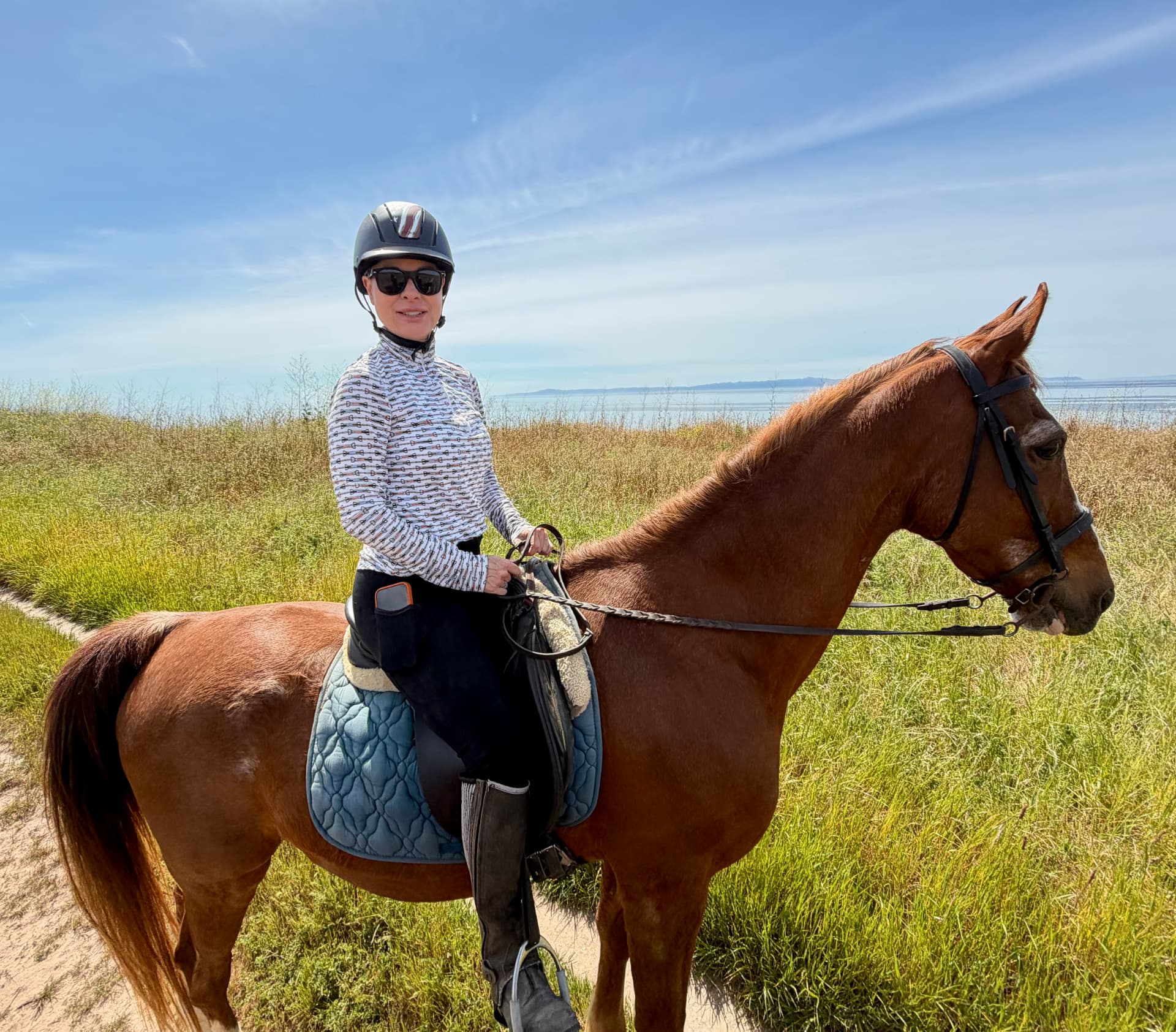 Kerri Jane, RN and founder of Kërfree Aesthetics, with her horse